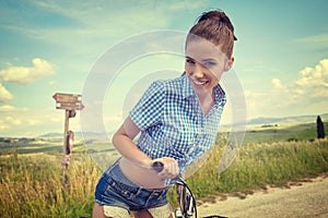 Woman with vintage bike outdoor, summer time