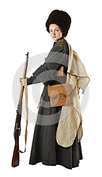 Woman in vintage costume with a rifle. photo
