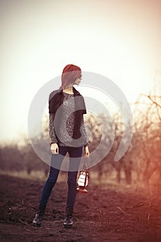 Woman with vintage lamp