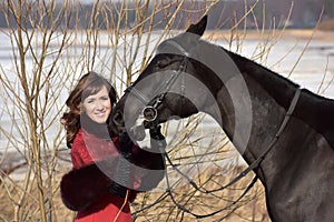 woman in vintage suit with horse