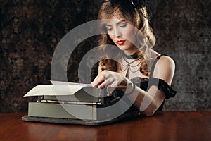 Woman and vintage typewriter