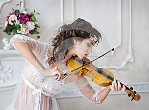 Woman with violin in white peignoir. Boudoir. seductive