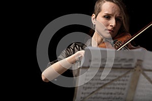 Woman violinist playing in a classical recital