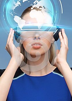 Woman in virtual reality 3d glasses with earth