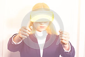 Woman in virtual reality device drive a video game