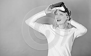 Woman with virtual reality headset. Woman watching virtual reality vision. Beautiful woman wearing virtual reality
