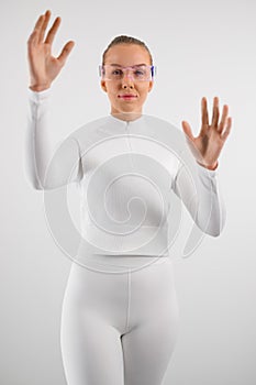 Woman in virtual reality smartglasses against white background