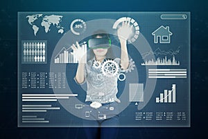 Woman with virtual screen and VR headset