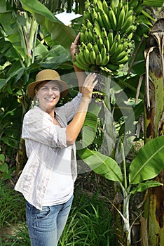 Woman visiting banana plantation