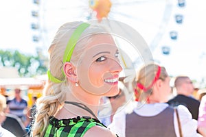Woman visiting Bavarian fair in national costume
