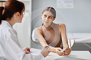 Woman visiting the doctor at hospital