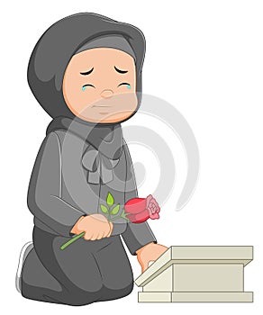 Woman visiting her parents grave