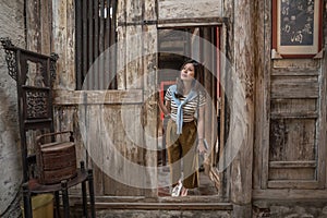 Woman visiting the old chinese house.