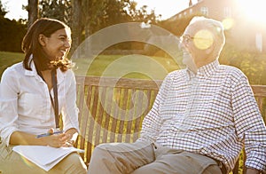 Woman Visiting Senior Male Relative In Assisted Living Facility photo
