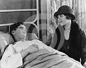 Woman visiting sick man photo