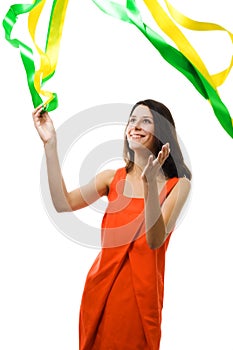 Woman in vivid color dress play with flying ribbon