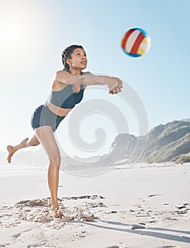 Woman, volleyball and hitting on beach in sports game, practice match or competition in the outdoors. Female person or