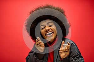 A woman with a voluminous afro