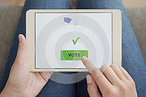 Woman Voting Online by Digital Tablet