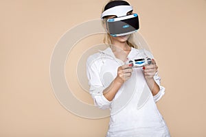 Woman with VR glasses of virtual reality. Young girl in virtual augmented reality helmet. VR headset.