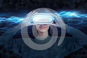 Woman in VR goggles, blue graph