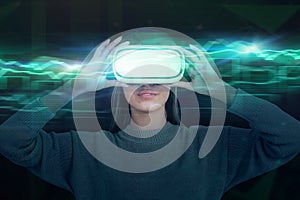 Woman in VR goggles, green graph