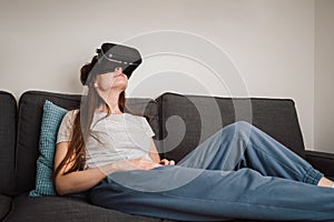 Woman with VR goggles traveling through the metaverse