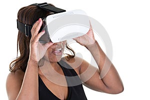 Woman in VR headset looking up and trying to touch objects on white background