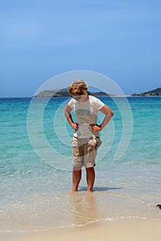 Woman wading on Caribbean beach