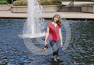 Woman Wading in Pond