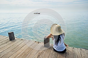 Woman waiting for boat at the dock