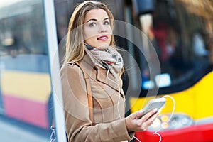 Woman Waiting at Bus Stop
