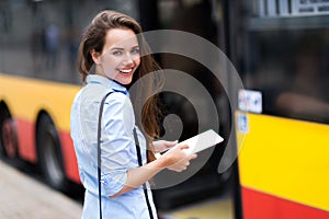 Woman waiting at bus stop