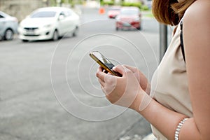 A woman is waiting for a cab