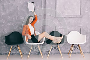 Woman waiting on the chair for decision of jon interview