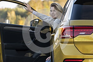 A woman waiting for roadside assistance.