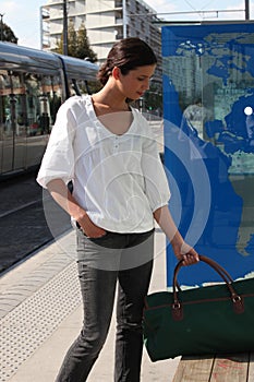 Woman waiting for the tram