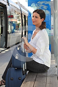 Woman waiting at tram station