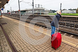 Woman waits for her train station