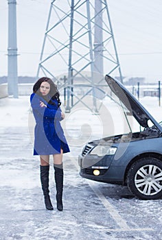 Woman waits for roadside assistance