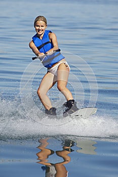 Woman Wakeboarding On Lake