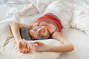 Woman waking up in early morning after sleep