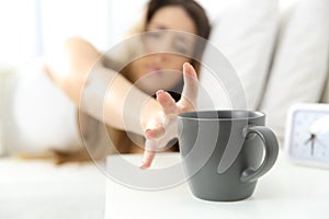 Woman waking up needing coffee photo