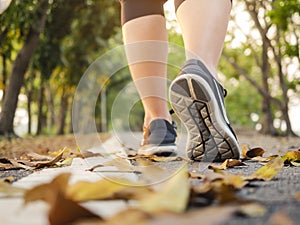 Woman walk in park outdoor Trail exercise healthy lifestyle