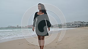 Woman walking alone at the beach