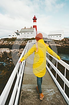 Woman walking alone on bridge at lighthouse Traveling