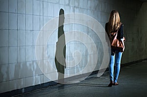 Woman walking alone at night photo