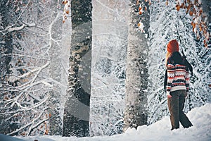 Woman walking alone in winter forest Travel Lifestyle