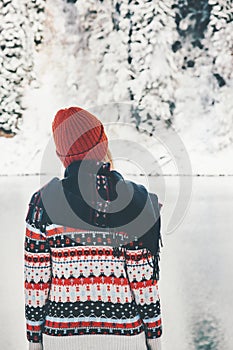 Woman walking alone in winter forest