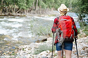 Woman walking along the river in the National Park.